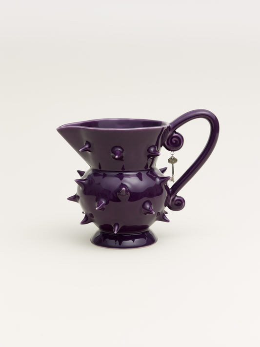 Handmade purple porcelain pitcher with a sleek design, ideal for displaying flowers or serving beverages in modern home decor
